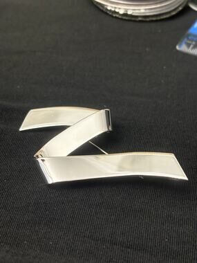Vintage Monet Silver Tone Ribbon Brooch Modernist Curved Pin
